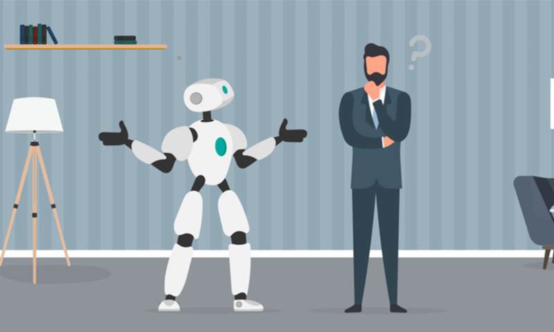 AIチャットボットと会話をするビジネスパーソン width=